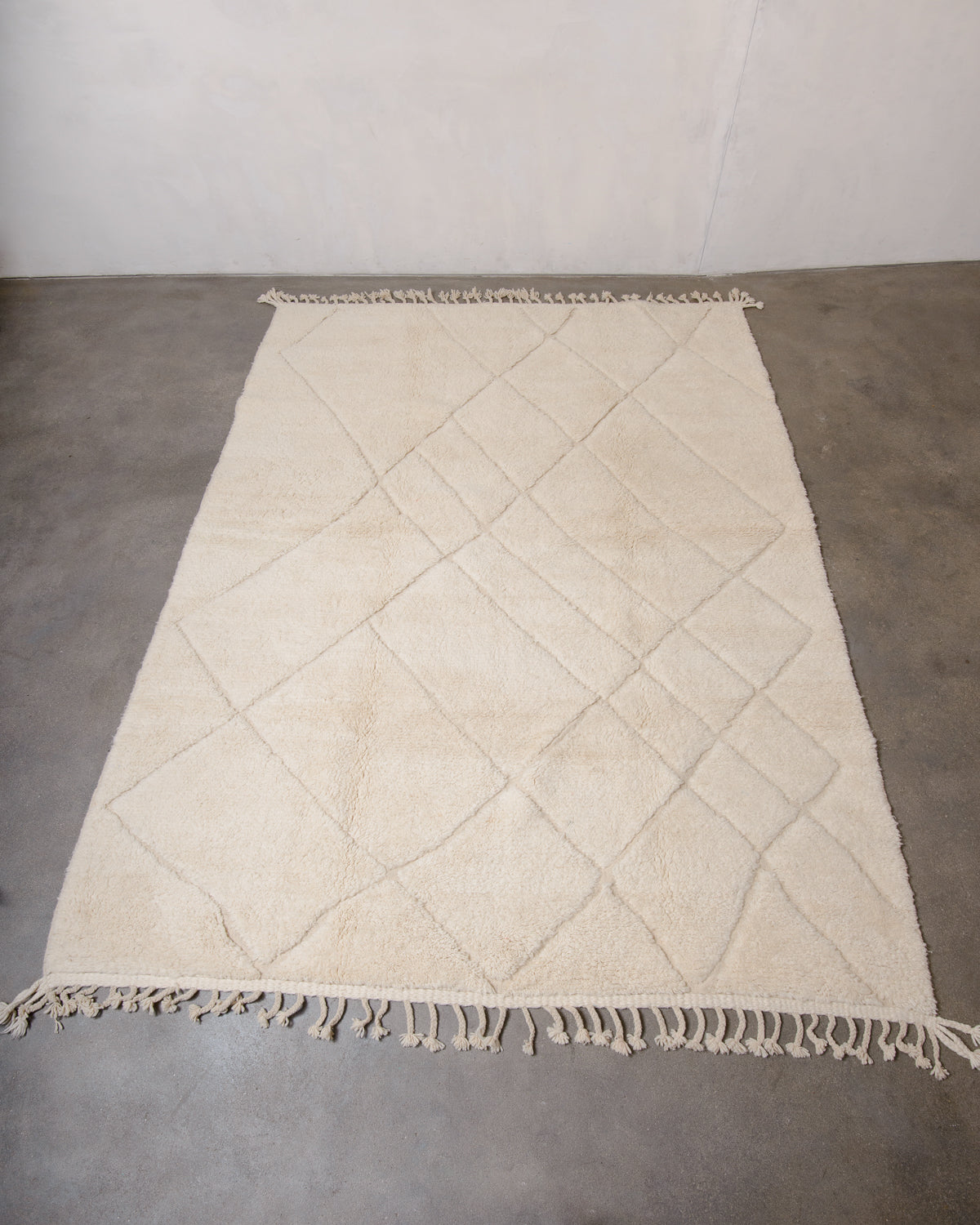 Modern, designer, handcrafted Berber rug from Morocco. Beniourain carpet with minimalist design, natural wool pile and a fluffy texture.